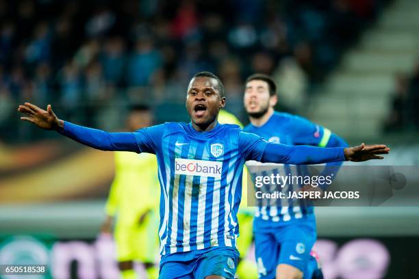 Genk's Mwbana Ally Samatta celebrates after scoring a goal during the UEFA Europa League round of 16 football match between KAA Gent and KRC Genk in...