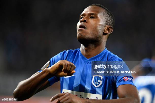 Genk's Mwbana Ally Samatta celebrates after scoring a goal during the UEFA Europa League round of 16 football match between KAA Gent and KRC Genk in...