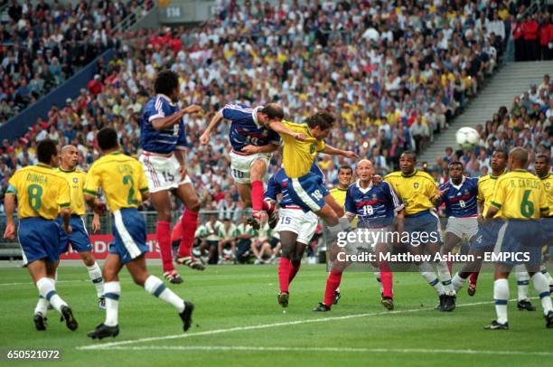 France's Zinedine Zidane scores the first goal with a header