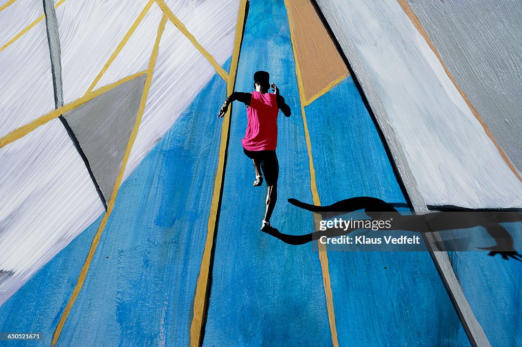 Male athlete sprinting, shot from above