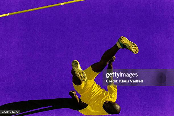 male athlete landing after highjump - shorts down stock pictures, royalty-free photos & images