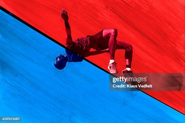 male athlete doing highjump - track and field event stock-fotos und bilder