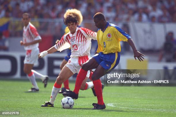 Tunisia's Riadh Bouazizi tries to tackle Colombia's Adolfo Valencia