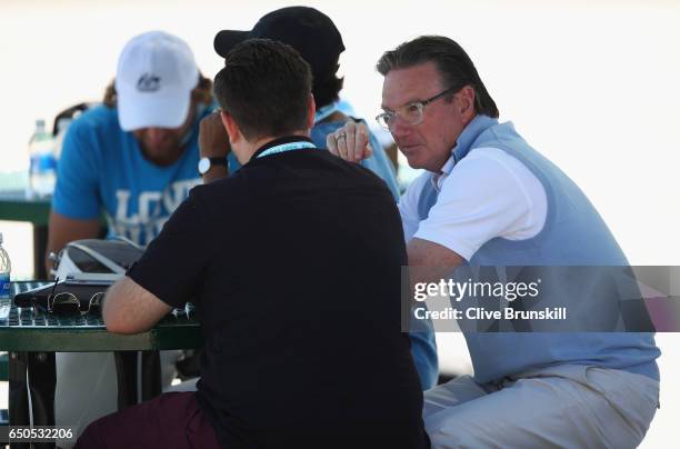 Jimmy Connors of the United States speaks with John Morris agent of Nick Kyrgios of Australia during his practice session during day four of the BNP...