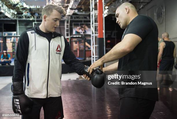 Ty Dillon, driver of the GEICO Chevrolet in the Monster Energy NASCAR Cup Series trains with Cain Velasquez during the UFC/NASCAR Cross-Training...