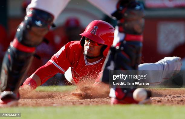 Nate Smith of the Los Angeles Angels of Anaheim scores in the ninth inning against the Cleveland Indians during the spring training game at Goodyear...