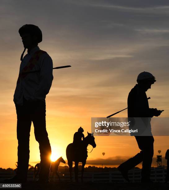 Jockeys Brian Higgins and Damien Oliver are seen during jumpout sessions at Flemington Racecourse on March 10, 2017 in Melbourne, Australia.