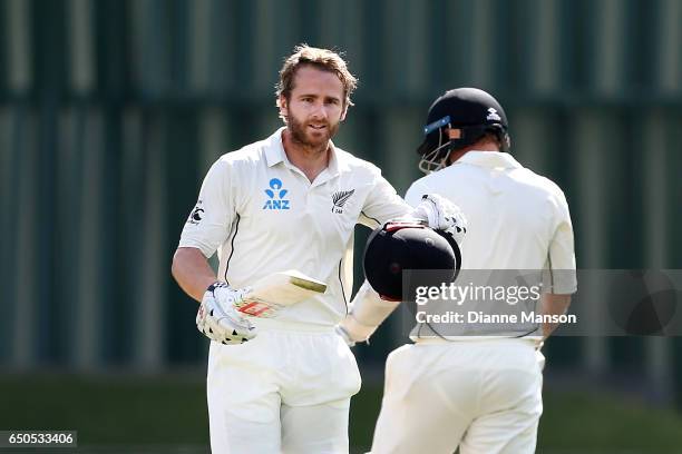 Kane Williamson of New Zealand celebrates his century during day three of the First Test match between New Zealand and South Africa at University...