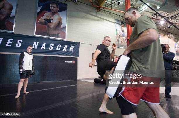 Ty Dillon, driver of the GEICO Chevrolet in the Monster Energy NASCAR Cup Series trains with Cain Velasquez during the UFC/NASCAR Cross-Training...