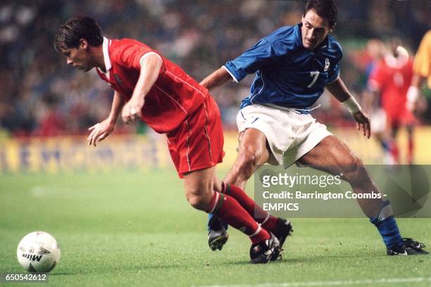 Wales's Darren Barnard and Italy's Diego Fuser battle for the ball
