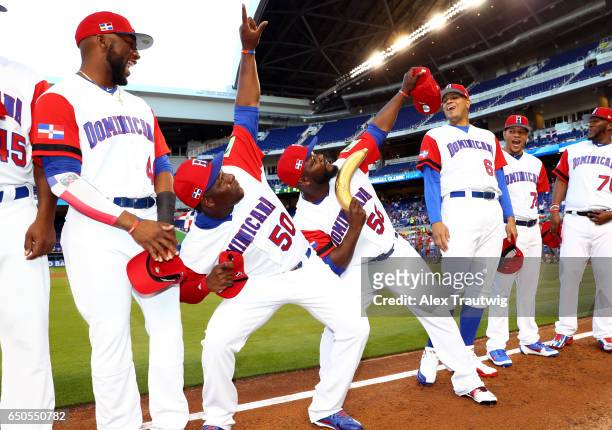 Hector Neris and Fernando Rodney of Team Dominican Republic point to the sky during player introductions prior to Game 1 of Pool C of the 2017 World...