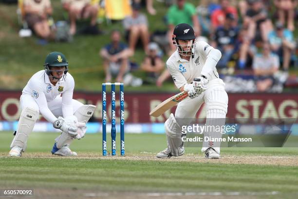 Kane Williamson of New Zealand celebrates his century during day three of the First Test match between New Zealand and South Africa at University...