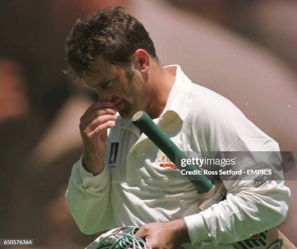 Australia captain Mark Taylor walks after being dismissed for a duck by England's Dominic Cork