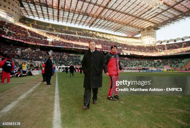 Milan coach Alberto Zaccheroni walks out into the San Siro Stadium