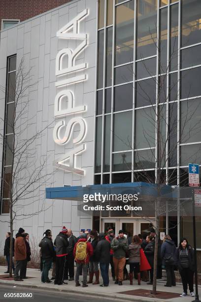 Unionized teachers with ASPIRA charter school network rally outside an ASPIRA high school to convince the company's management to come to terms on a...