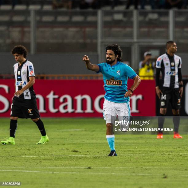 Peru's Sporting Cristal Jorge Luis Cazulo, celebrates after scooring against Brazil's Santos during their Libertadores Cup football match at the...