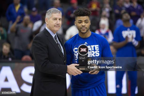 Kansas Jayhawks guard Frank Mason III receives the Big 12 Player of the year award prior to the Big 12 conference mens basketball tournament game...