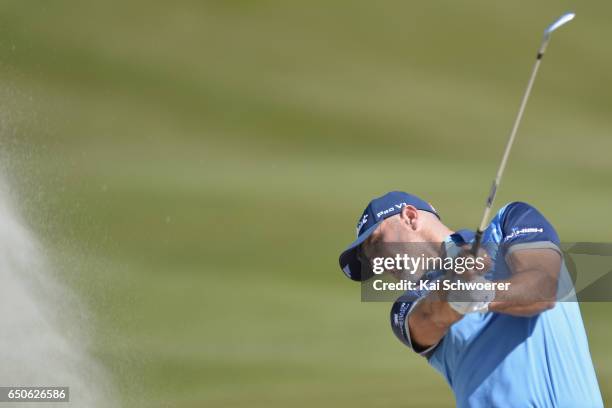 Michael Hendry of New Zealand plays a bunker shot during day two of the New Zealand Open at Millbrook Resort on March 10, 2017 in Queenstown, New...