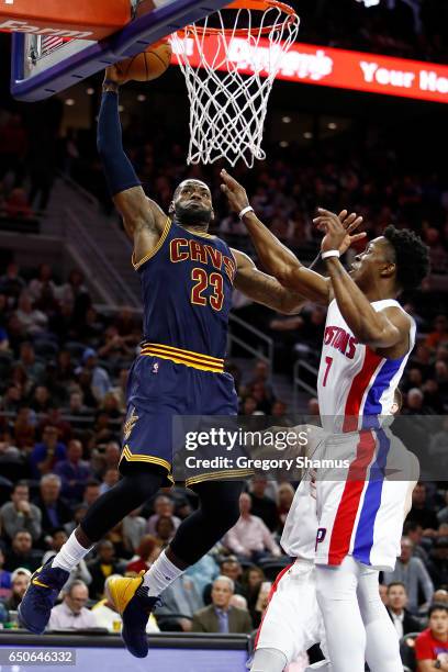 LeBron James of the Cleveland Cavaliers dunks behind Stanley Johnson of the Detroit Pistons during the first half at the Palace of Auburn Hills on...