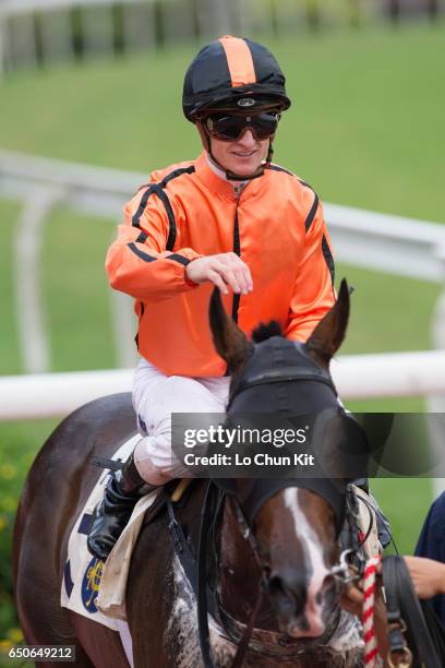 Jockey Zac Purton riding Jing Jing Win wins the Race 6 A. Lange & Sohne Excellent Handicap at Sha Tin racecourse on October 23, 2016 in Hong Kong,...