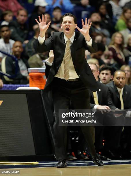 Bryce Drew the head coach of the Vanderbilt Commodoresgives instructions to his team against the Texas A&M Aggies during the second round of the SEC...