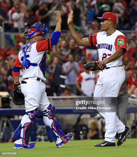 Jeurys Familia and Welington Castillo of the Dominican Republic react to winning a Pool C game of the 2017 World Baseball Classic against Canada at...