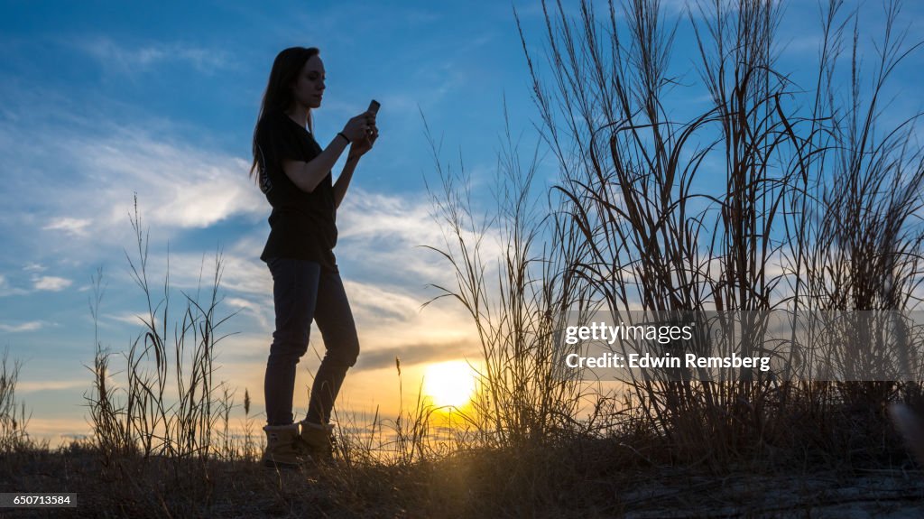 Texting on the beach