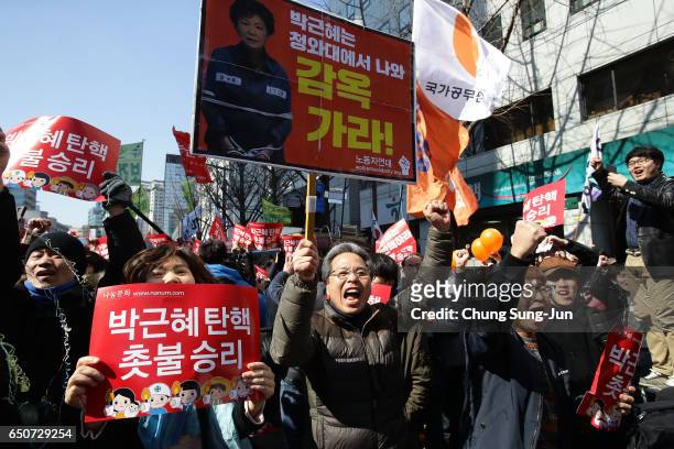 South Koreans celebrate after hearing the Constitutional Court's verdict on March 10, 2017 in Seoul, South Korea. South Korean President Park...