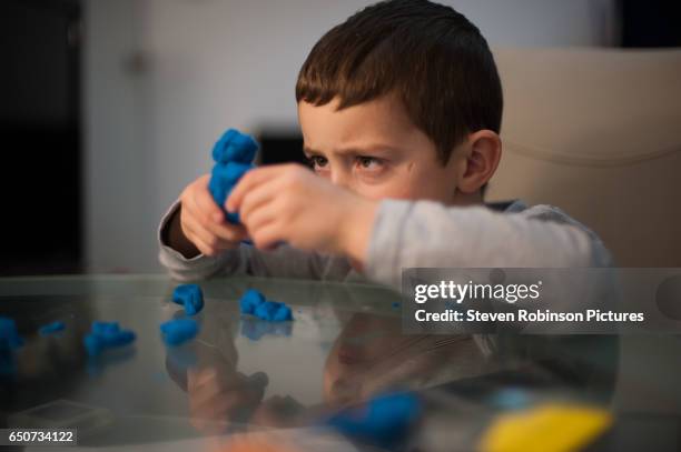 boy and play clay - child's play clay stock pictures, royalty-free photos & images