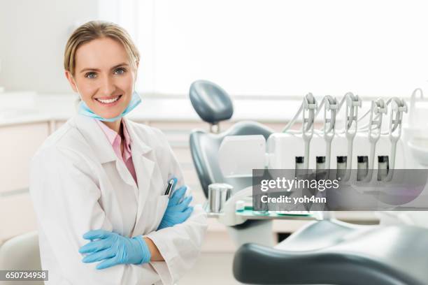 smiling dental expert - dental hygienist stock pictures, royalty-free photos & images