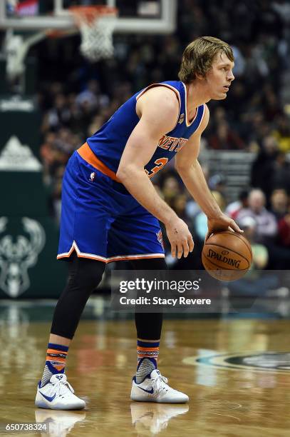 Ron Baker of the New York Knicks handles the ball during a game against the Milwaukee Bucks at the BMO Harris Bradley Center on March 8, 2017 in...