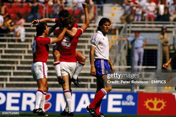 England's Bryan Robson celebrates with team mates Trevor Francis and Terry Butcher after scoring the fastest goal in World Cup history.