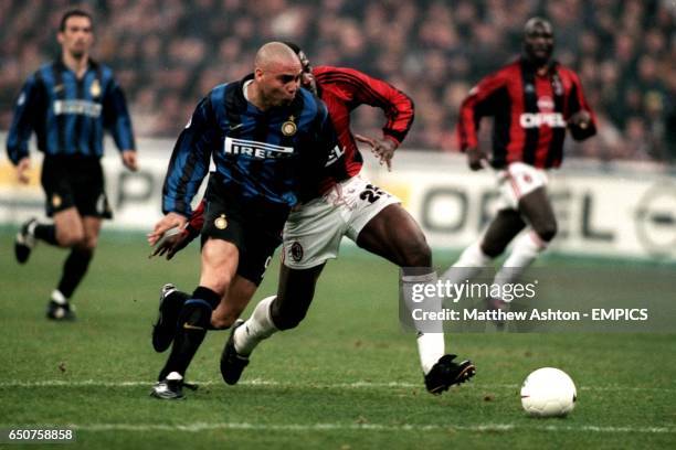 Inter Milan's Ronaldo gets past Bruno N'Gotty of AC Milan