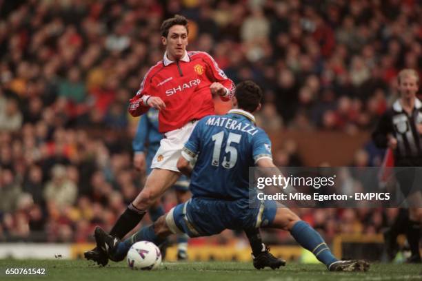 Manchester United's Jonathan Greening is tackled by Everton's Marco Materazzi
