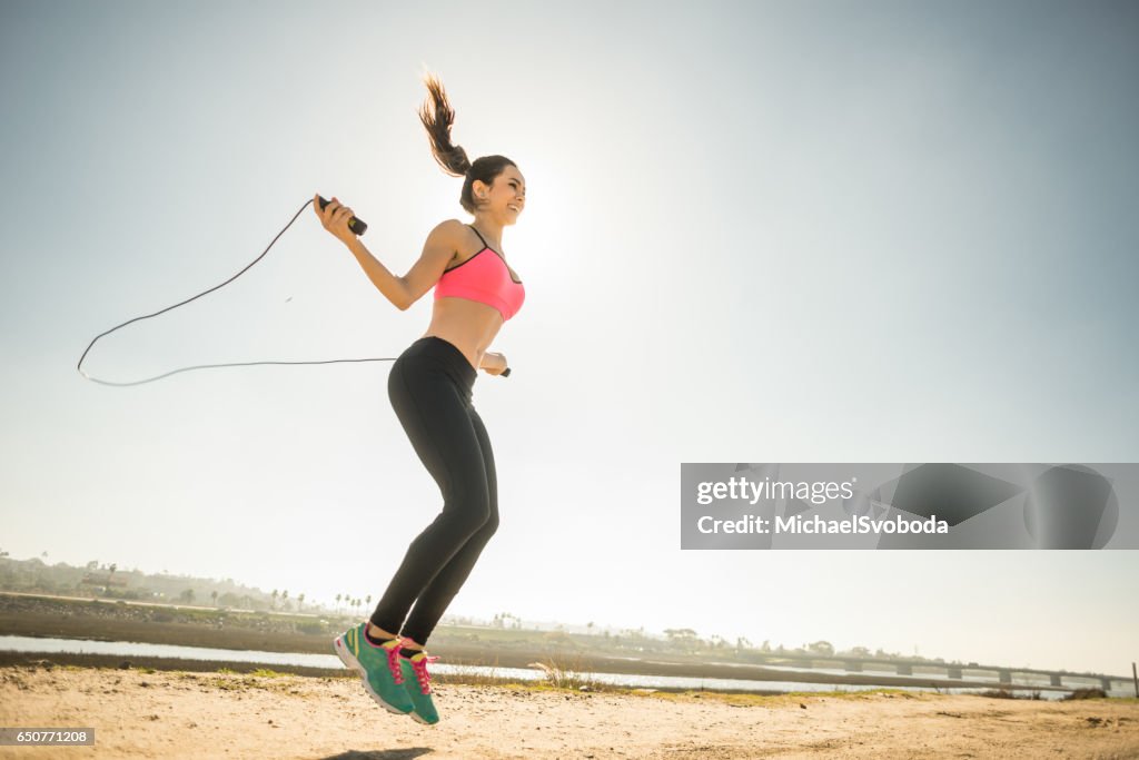 Jump Roping Woman Young Women Jump Roping By San Diego River High-Res Stock Photo - Getty ...
