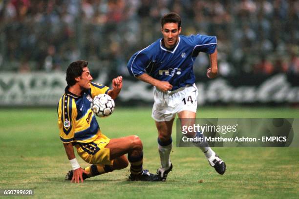 Parma's Diego Fuser and Rangers' Tony Vidmar battle for the ball