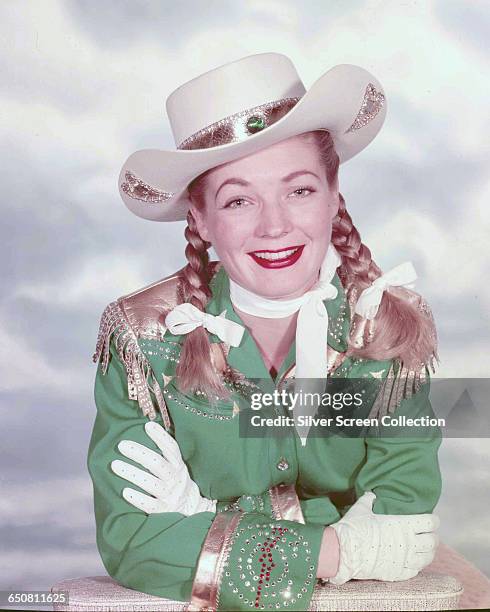 American actress Gail Davis as the titular sharpshooter in the television series 'Annie Oakley', circa 1955.