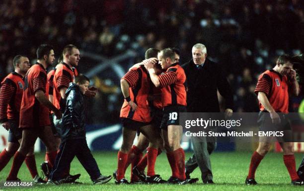 Scotland coach Jim Telfer consoles his players Gregor Townsend and Alan Tait after their defeta by New Zealand. It was Telfer's final game in charge...
