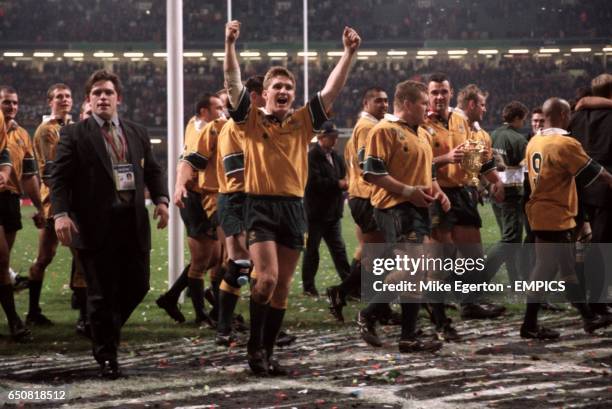 Australia's Tim Horan celebrates at the end of the game.