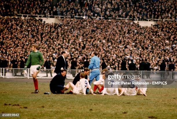 Leeds United goalkeeper Gary Sprake stands alone as the rest of the Leeds team Mick Jones, Billy Bremner, Paul Madeley, Peter Lorimer, Jack Charlton,...