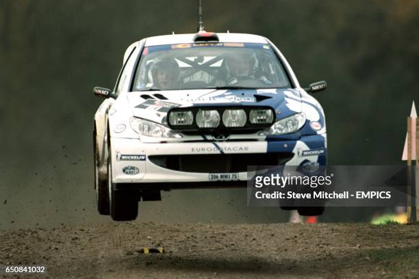 Francois Delecour takes a jump at Blenheim Palace in his Peugeot