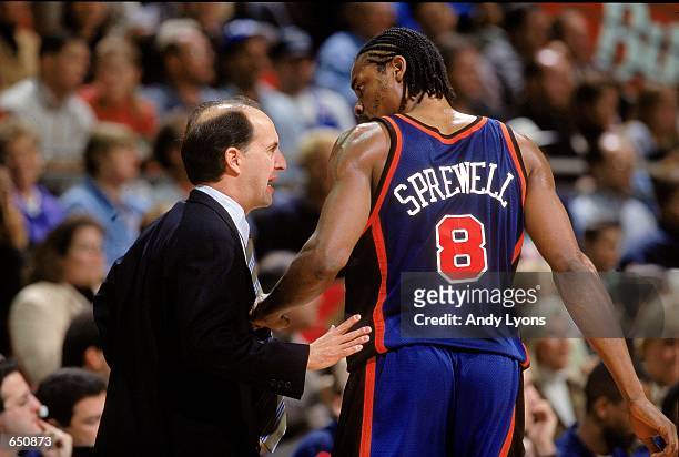 Jeff Van Gundy of the New York Knicks talks to Latrell Sprewell during the game against the Orlando Magic at the TD Waterhouse Centre in Orlando,...