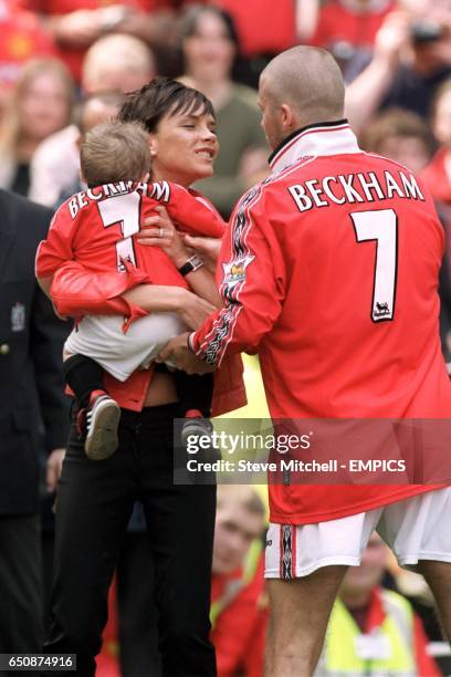 Manchester United's David Beckham with wife Victoria and son Brooklyn