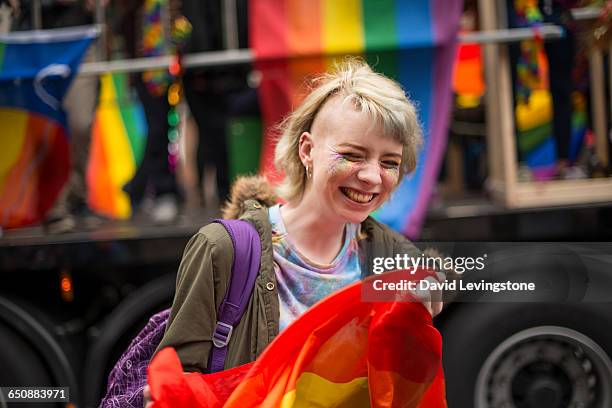 woman celebrating pride - pride fest stock-fotos und bilder