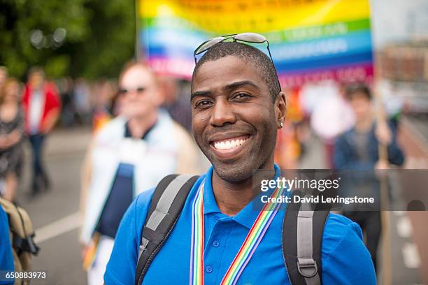 proud gay man during pride parade - gay pride parade 個照片及圖片檔