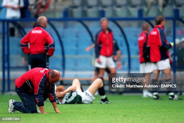 Norway coach Nils Johan Semb sinks to his knees in the Gelredome in Arnham after hearing that Spain defeated Yugoslavia 4-3 and knocked Norway out of...