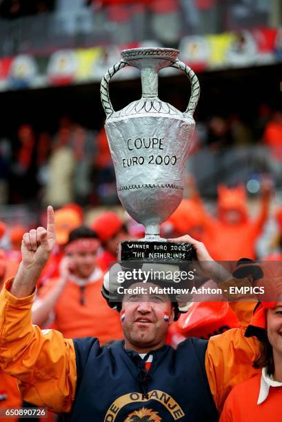 Dutch fan celebrates with a homemade European Championship trophy