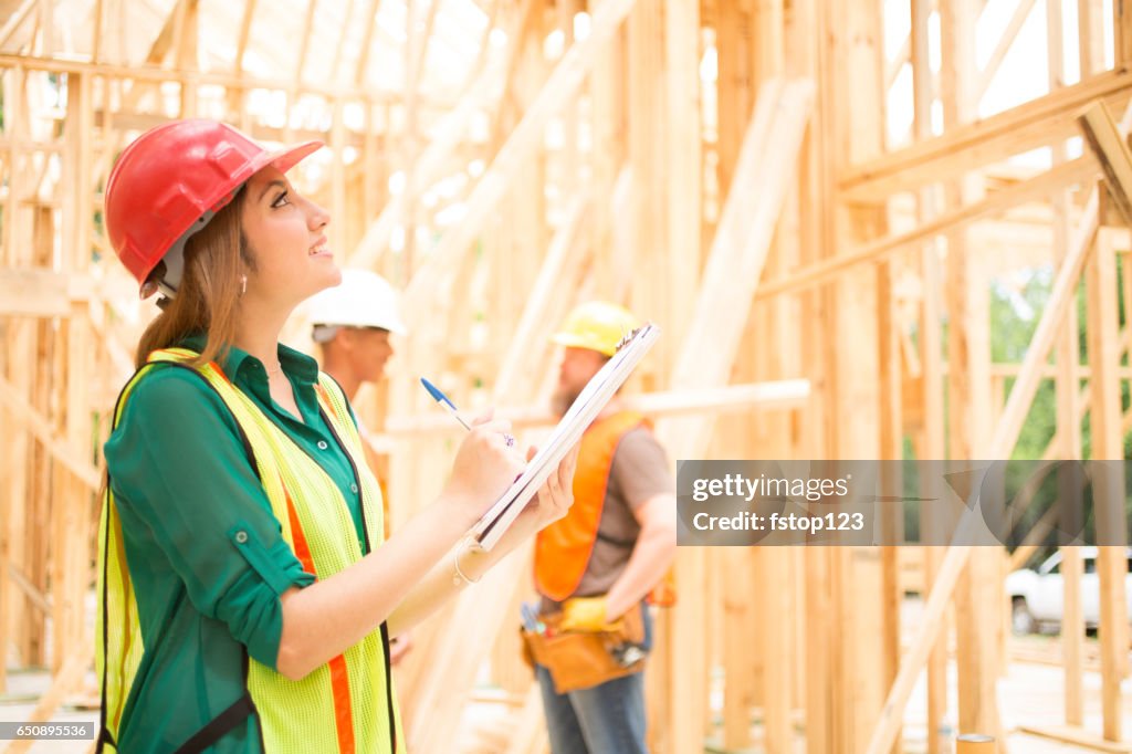 Construction workers in building site.