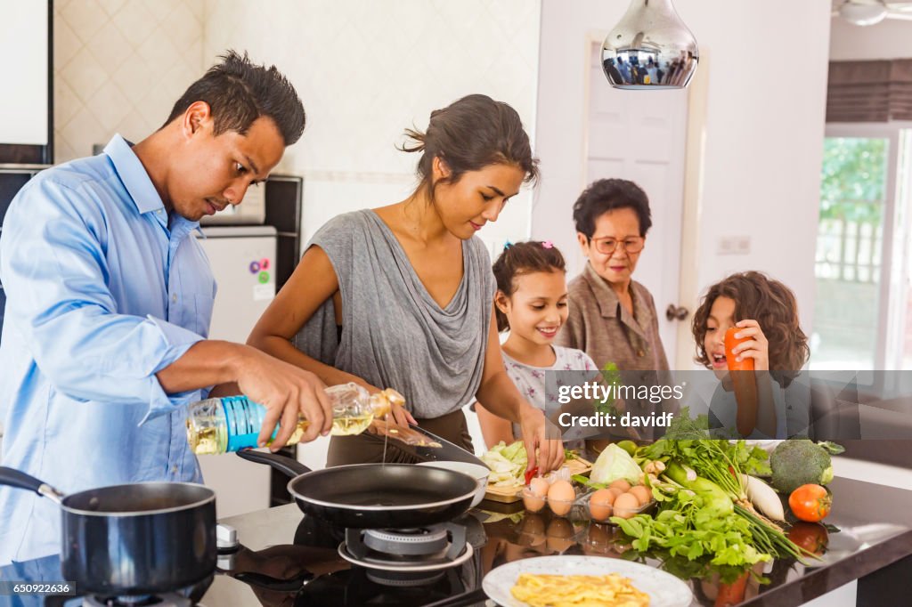 Three Generation Asian Family Cooking Healthy Food Together