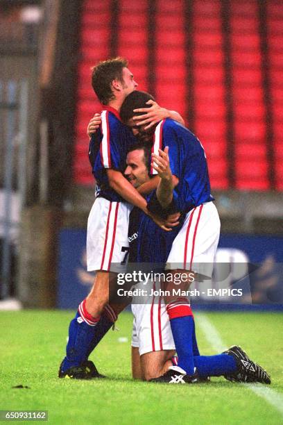 Linfield's Glenn Ferguson is congratulated on one of his two goals by teammates Christopher Morgan and Norman Kelly